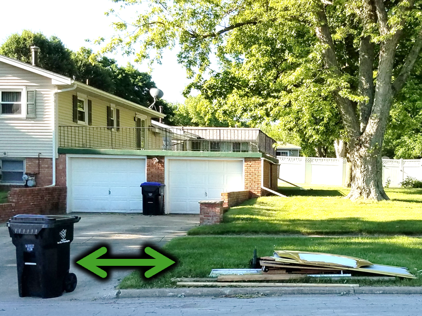 Bulk is behind the curb and 4 feet away from the garbage cart