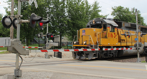 Photo of a Union Pacific train at a train crossing.